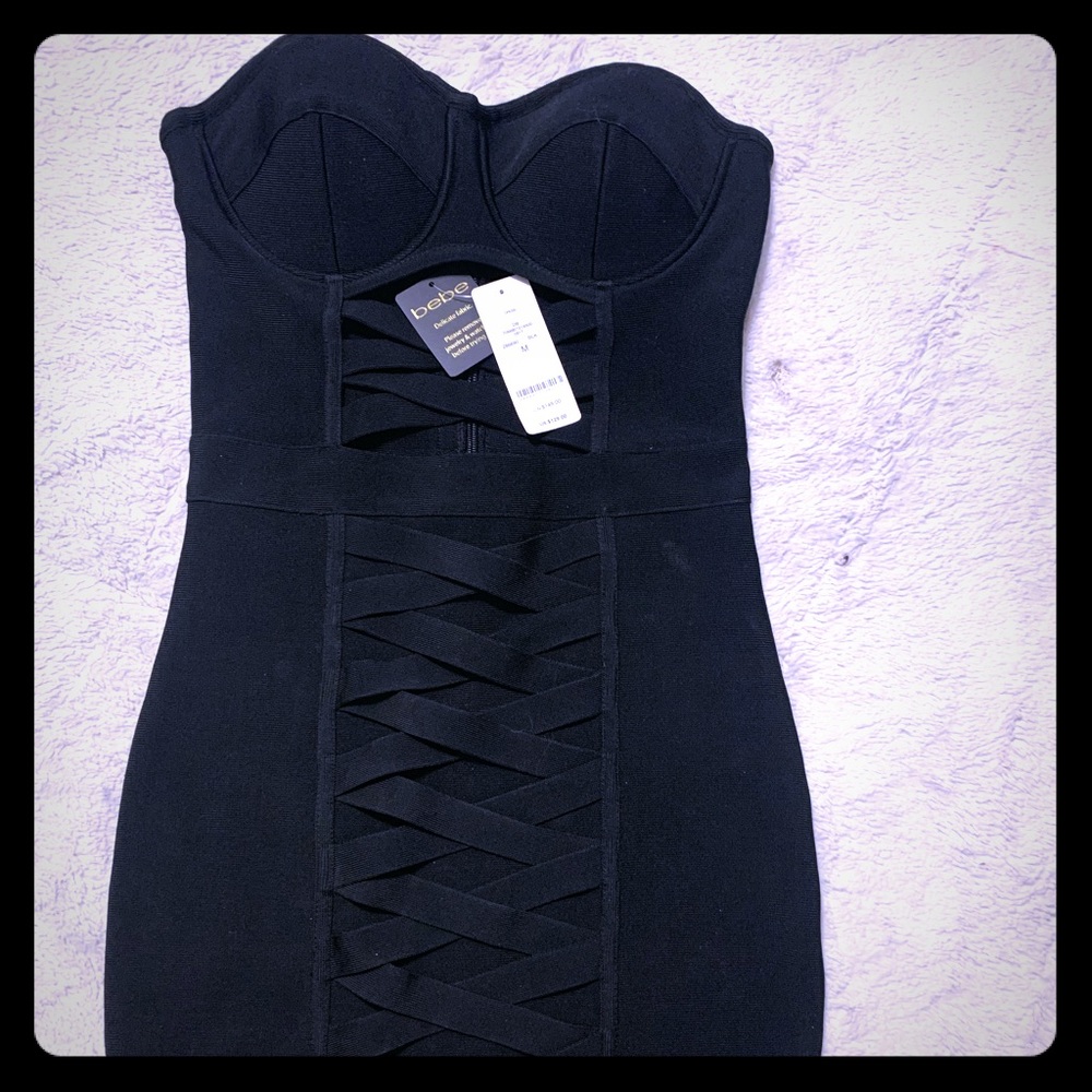 Brand new with tags, BEBE dress.  Size medium.
